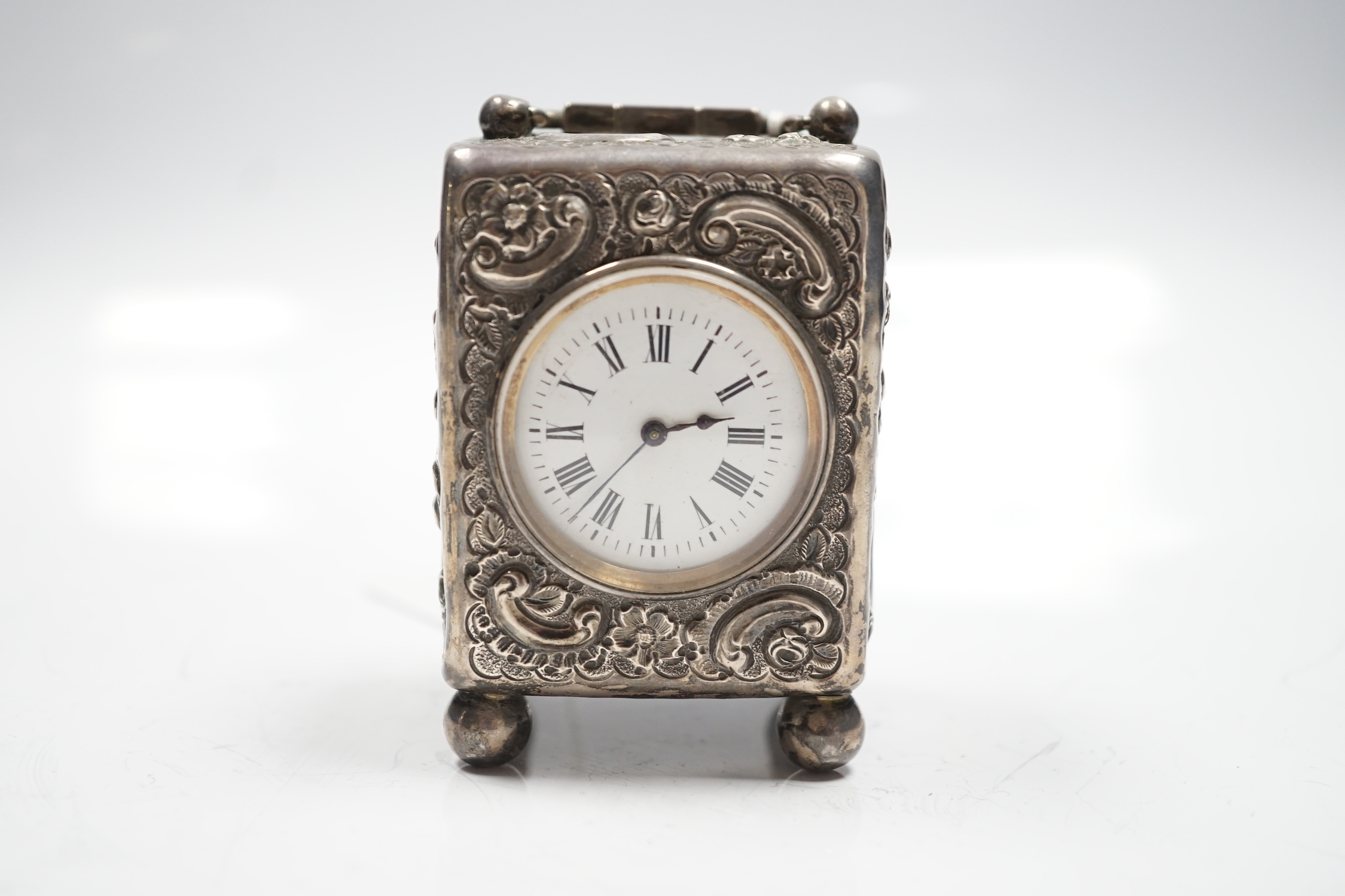 A late Victorian repousse silver cased carriage timepiece, John Newton Mappin, London, 1894, 79mm.